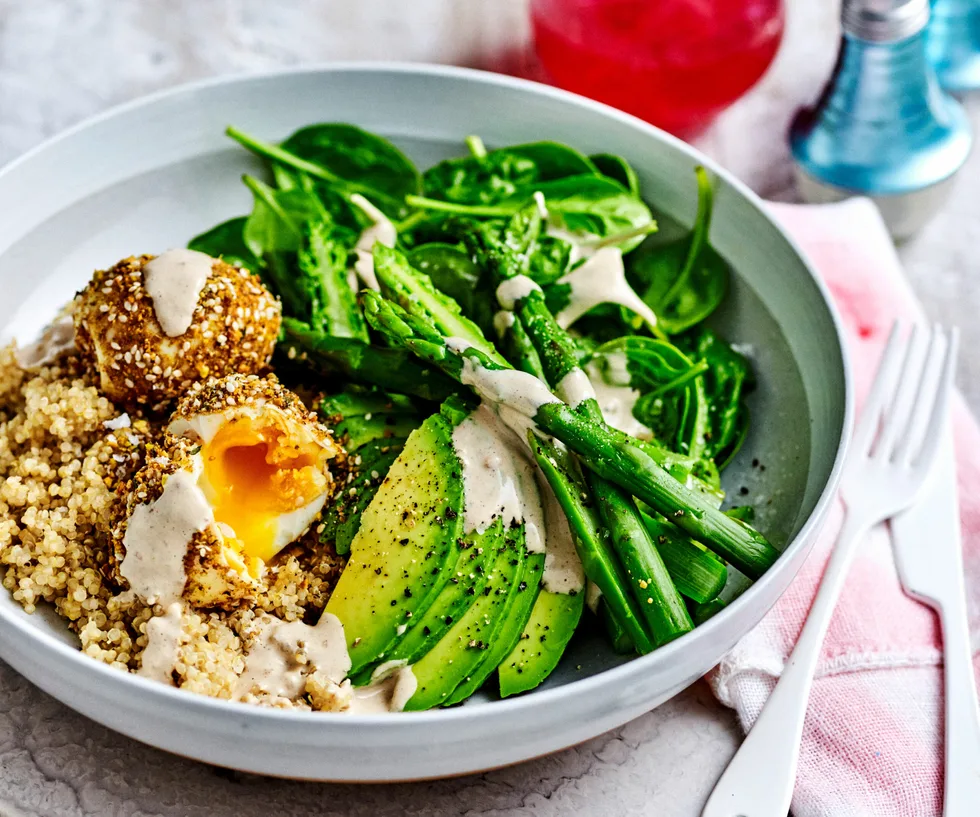 Breakfast bowl with asparagus, spinach, quinoa, and dukkah eggs.