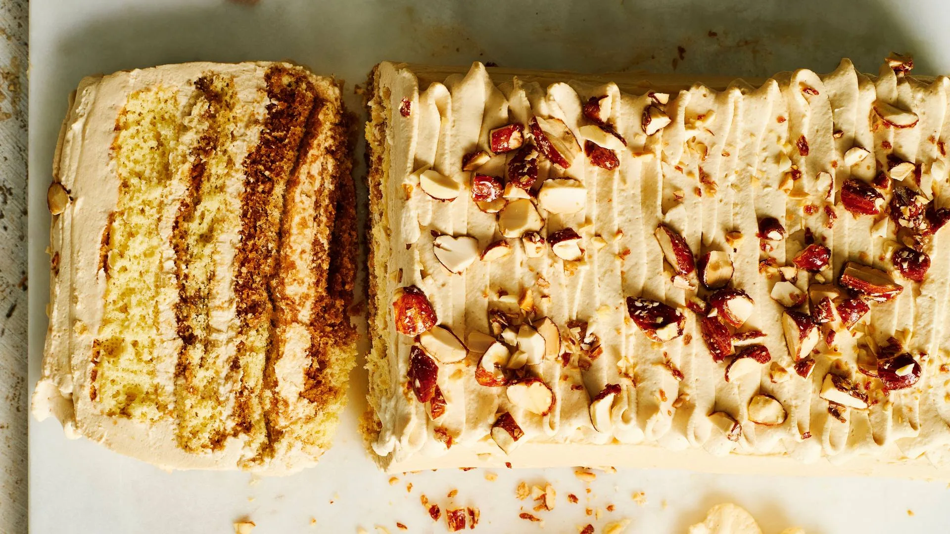 tiramisu torte with a slice on the board