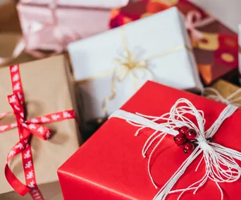 three christmas gift boxes wrapper with red paper