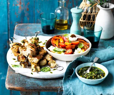 Chicken skewers with peach caprese salad