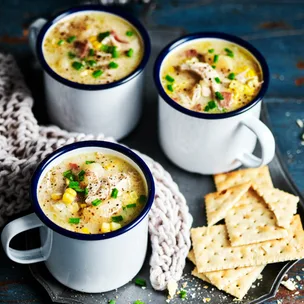 slow cooker chicken and corn soup in mugs with crackers