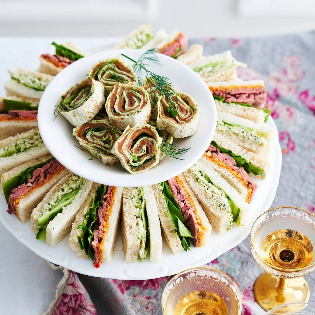 Chicken and cucumber sandwiches on a platter