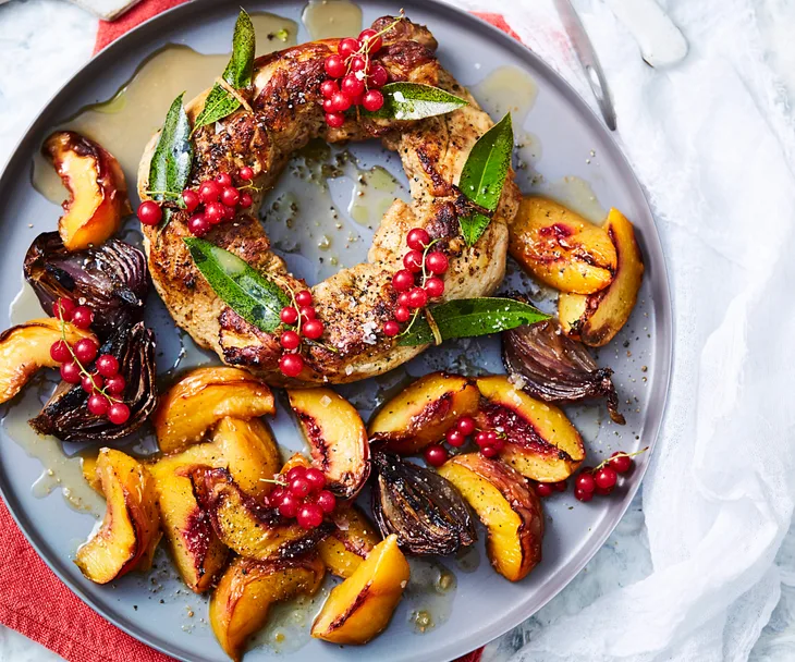 Roast pork wreath with stone fruit