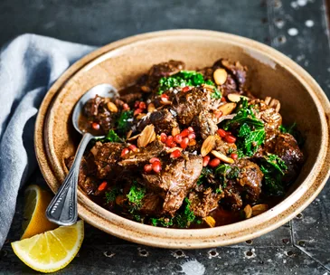 Slow-cooker lamb with kale and pomegranate