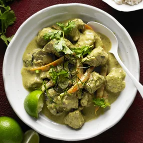 slow cooker pork curry in a white bowl