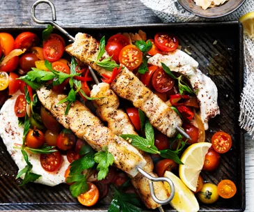 Fish skewers with labne and chilli tomato salad