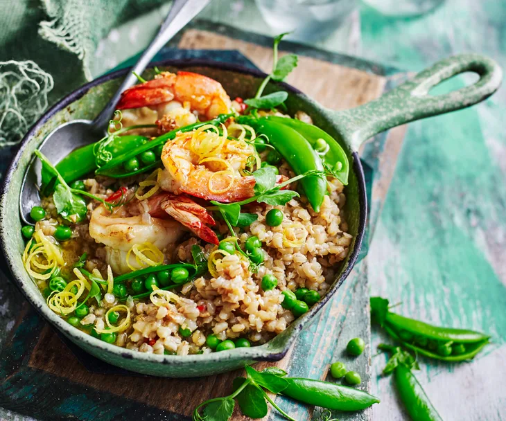 Pea and barley risotto with garlic prawns