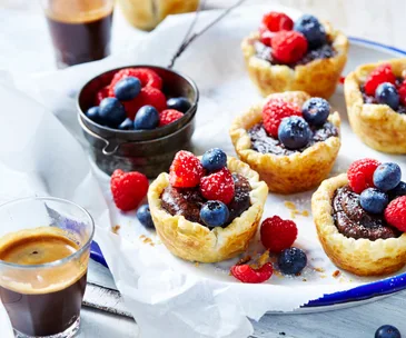 Chocolate custard tarts with fresh berries