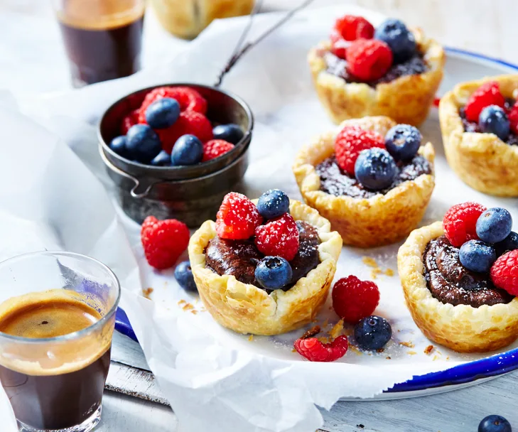Chocolate custard tarts with fresh berries