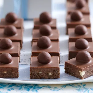 Malteser slice cut into pieces, each with a malteser on top