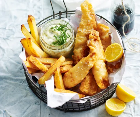 A basket of golden fish and chips.