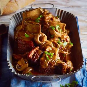 beef bourguignon slow cooker in a serving dish