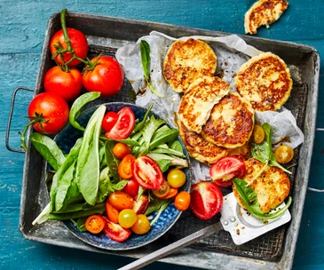 Ricotta fritters with tomato salad