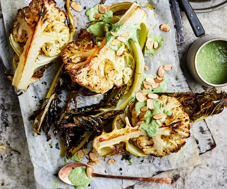 Cauli wedges with green tahini and almonds