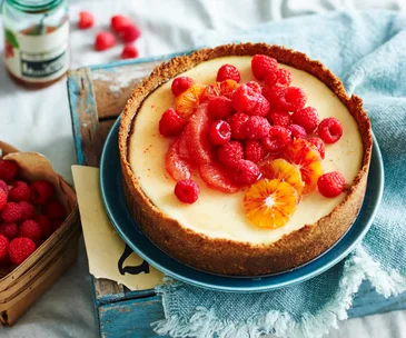 Orange labne cheesecake with ruby fruit salad