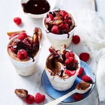 quick chocolate mousse in cups topped with raspberries and dates