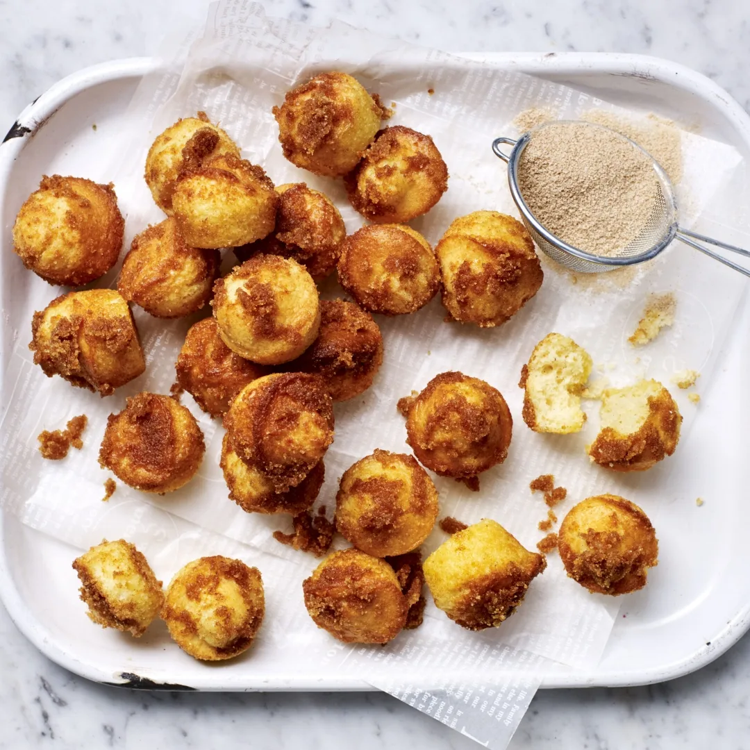 air fryer donut bites on a white tray