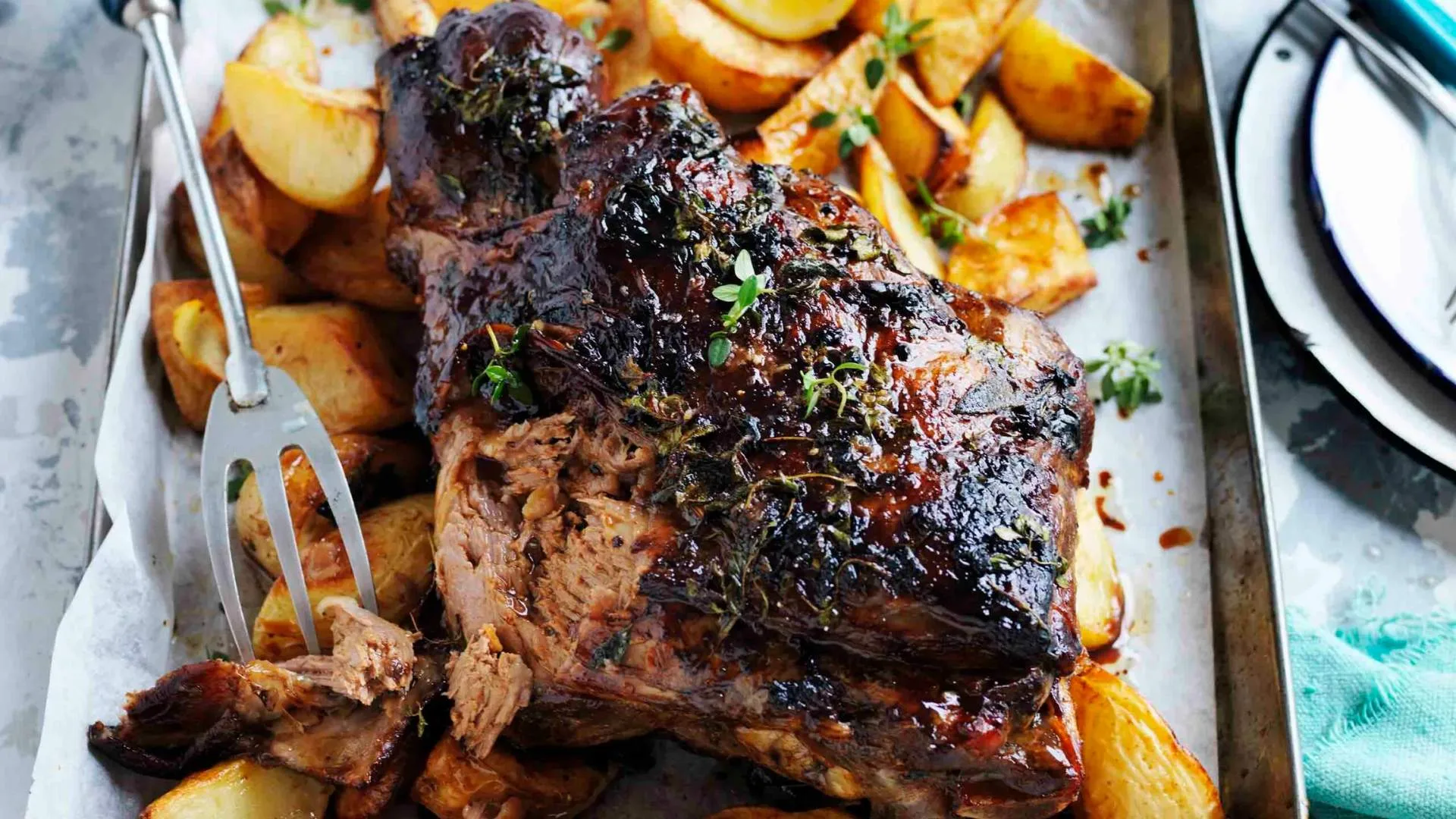 Greek roast lamb dinner with skordalia and lemony potatoes.