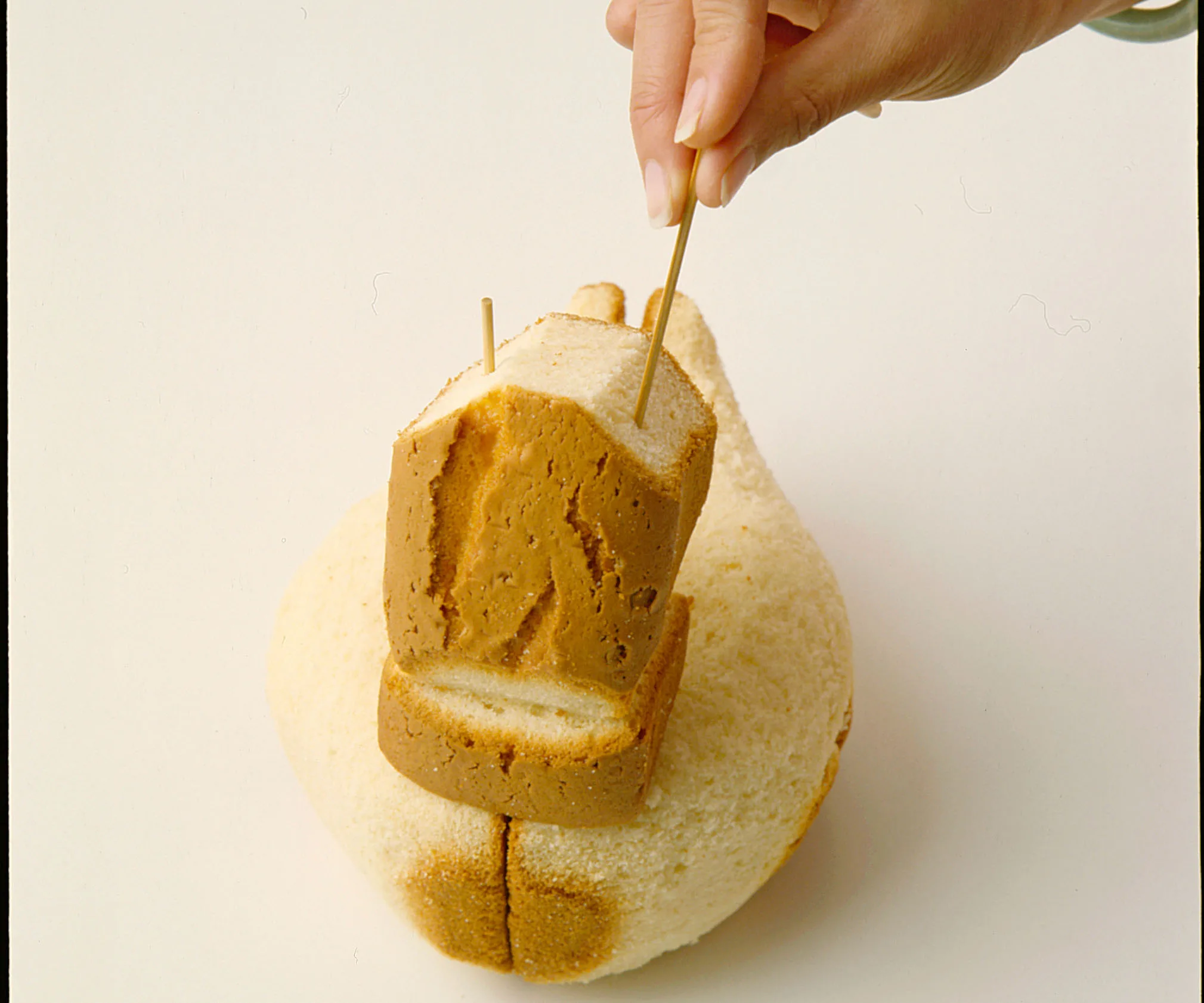 Bamboo skewers secure the head and neck of the Duck Cake.