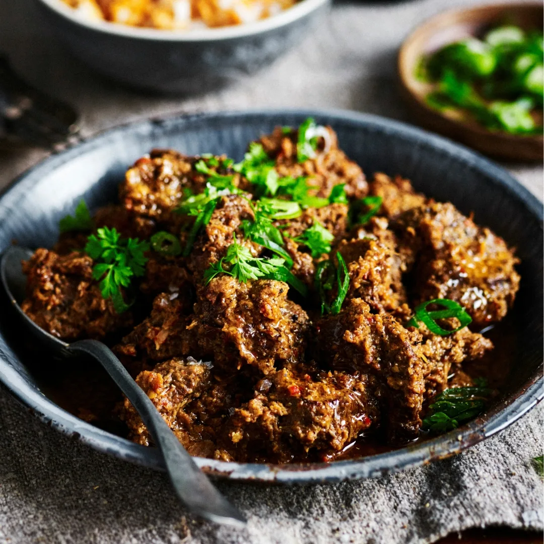 slow cooker beef rendang curry in a bowl