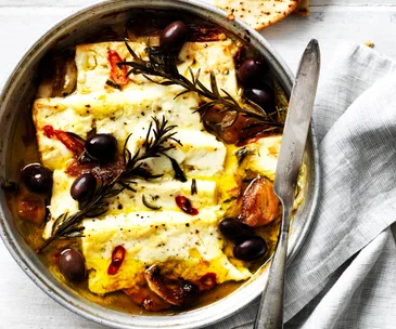 Baked fetta with roasted garlic, chilli and olives