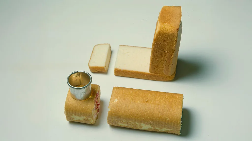 Cut the pieces of cake to form a train carriage