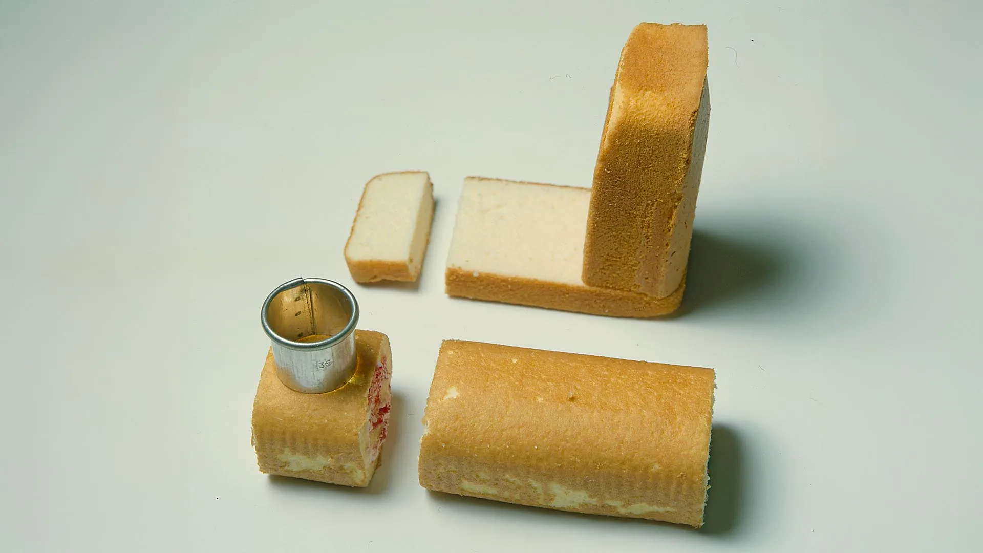 Cut the pieces of cake to form a train carriage