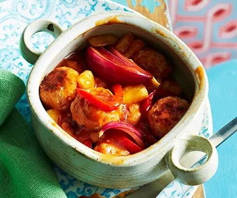 sweet and sour pork meatballs in a serving dish