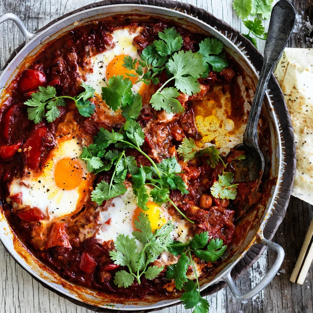 chickpea shakshuka with eggs and herbs