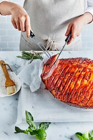 Glazed ham being carved