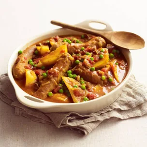 Creamy curried sausages with potatoes made in the slow cooker