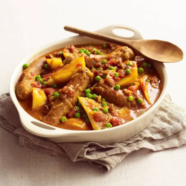 Creamy curried sausages with potatoes made in the slow cooker