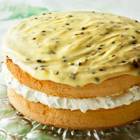 Feather sponge cake with passionfruit icing, filled with cream