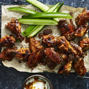 buffalo chicken wings with cucumber and yoghurt dipping sauce