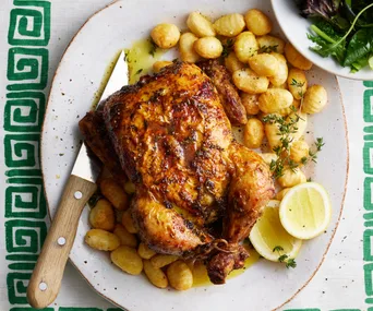 roast chicken and gnocchi on a serving plate