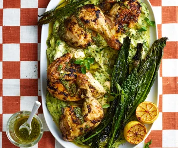 roast chicken pieces on a bed of cheesy polenta