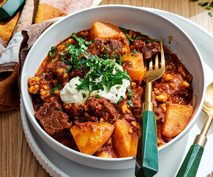 Bowl of beef p&ouml;rk&ouml;lt stew with tarhonya