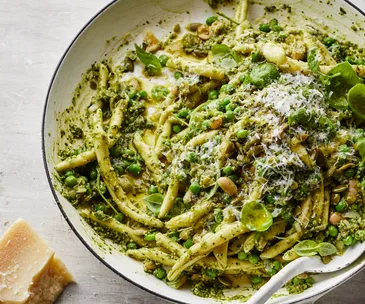 Pan of warm green pea pasta.