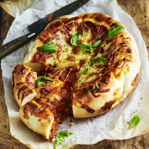 slow cooker deep dish pizza with cheese, pepperoni and basil