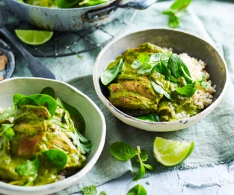 Two bowls of chicken masala curry