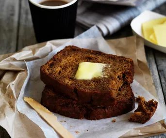 banana bread slices with butter on top