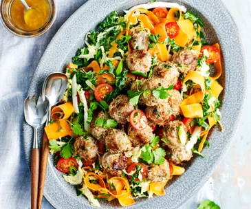Platter of pork noodle balls with Asian salad