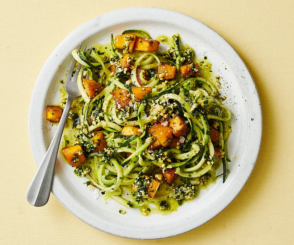 Plate of honey soy pumpkin with zucchini noodles and cashews