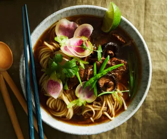 Bowl of beef ramen with shiitake mushrooms