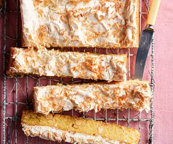 Lemon meringue blondie sliced on a wire rack