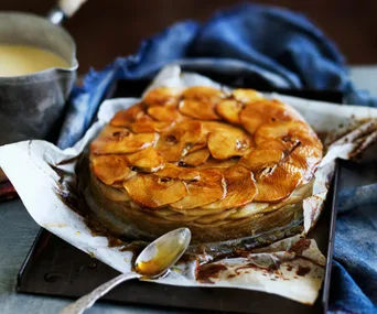 baked apple slices arranged into a cake shape