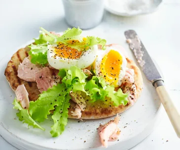 steamed eggs with salmon on pitta bread