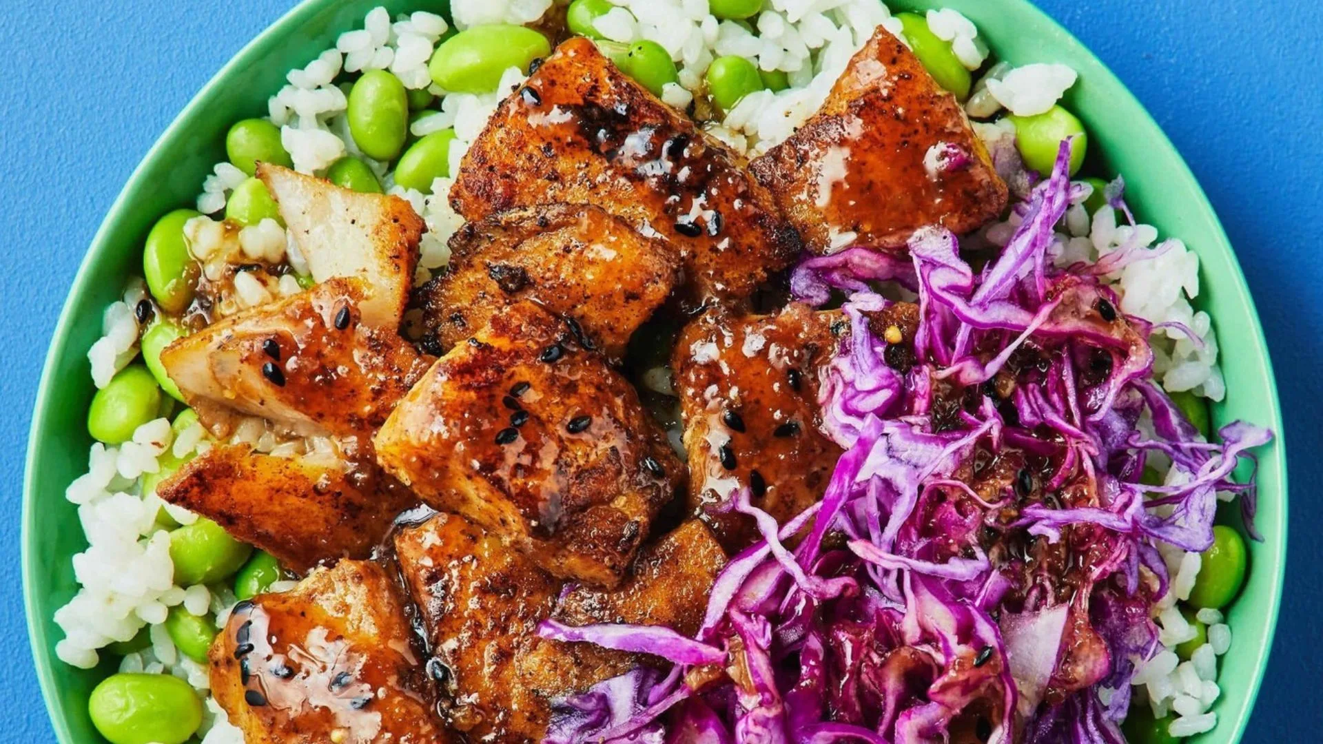 Basa Rice Bowl from Dinnerly, sat against blue background