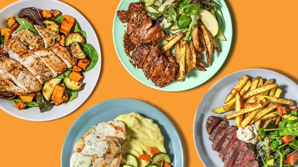 Everyplate dishes on a bright orange background