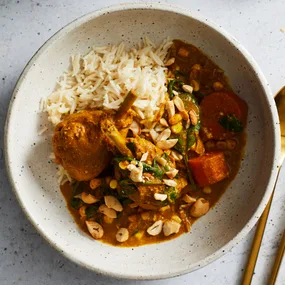 Slow cooker butter chicken with rice in a bowl